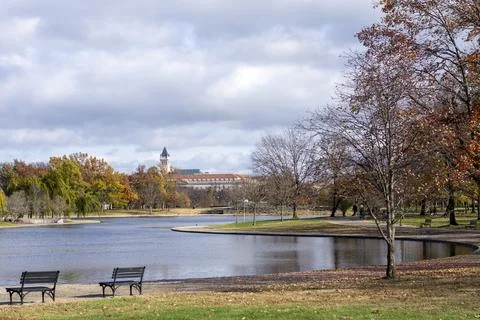 A park with a lake on a Autumn day Stock Photos