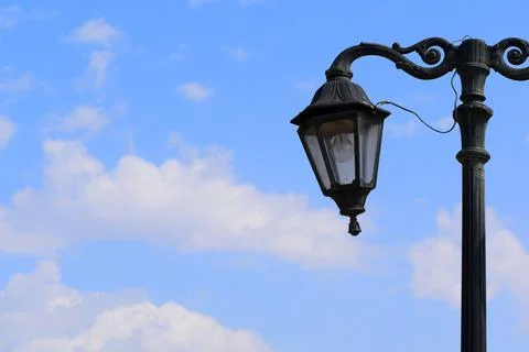 Park lamp having cloudy background. Blue sky. Stock Photos