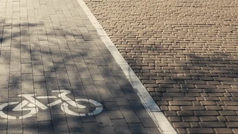 Park path made of stone. Walk and rest in the city. City life. Morning running.  Video stock 107085128