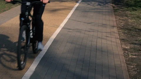 Park path made of stone. Walk and rest in the city. City life. Morning running.  動画素材 107085931