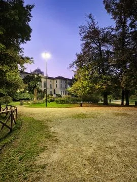 Park Pathway at Dusk with Lamp Light Stock Photos