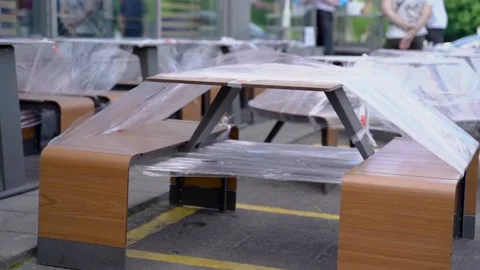 A park picnic table taped off as a result of one of the many mandates due to the Stock Footage 133160907