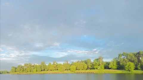 Park with pond in sunny weather timelapse Stock Footage