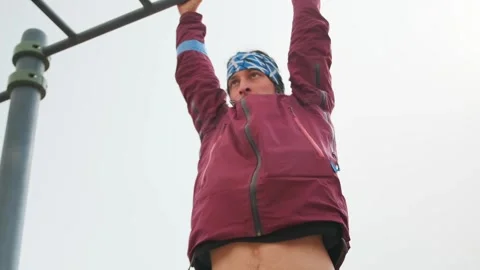 Park Pullup Effort, Someone Doing Pullups At Park Under Cloudy Skies, Individua Stock Footage 326872256