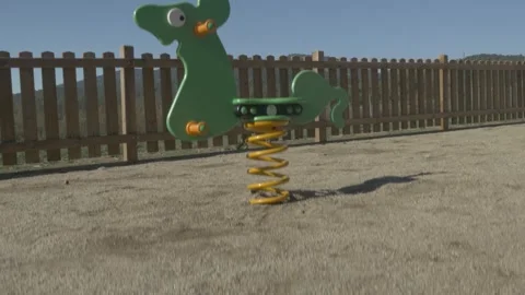 Park ride swing gimbal stabilized traveling children kids fence up Stock Footage 322786296