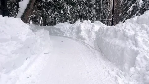 Park road after massive blizard. Cleared road after a snow storm in the city Stock Footage 263007783