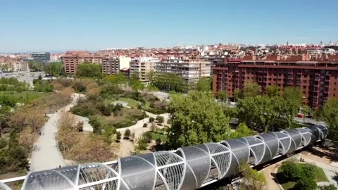 Park sun trees city bridge Spain Madrid Madrid Rio Arganzuela Manzanares Stock Footage