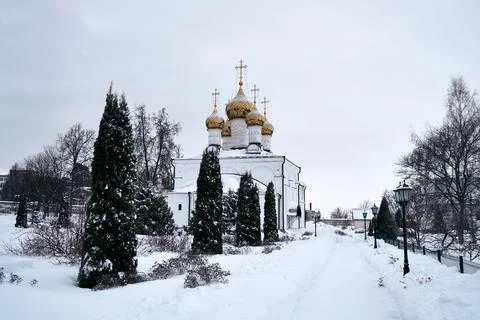Park on the territory of the Solotchinsky monastery on a cloudy winter day Stock Photos