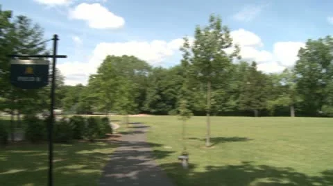 A park with a walking path and field Stock Footage 8981289