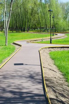 Park walking path with a lantern in the spring. Improvement of the park Foto stock