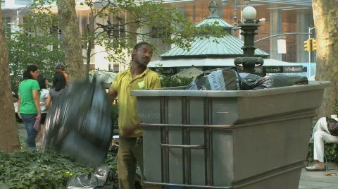 Park worker disposes of garbage (2 of 2) Stock Footage 839587