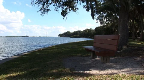 ParkBenchAtLake Stock Footage 1002796
