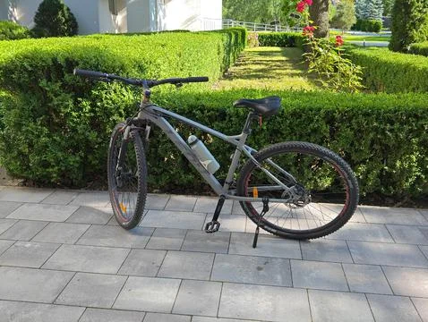 Parked bicycle side view Stock Photos