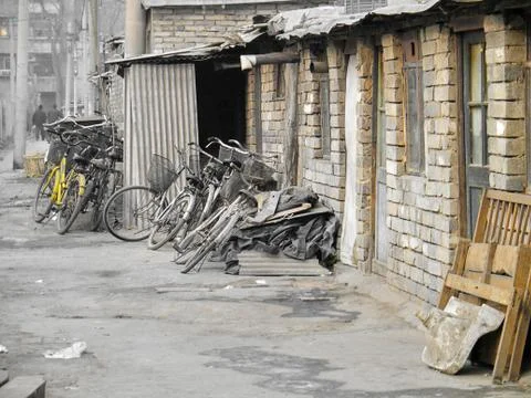 Parked bicycles in a working class district in the middle of Beijing Stock Photos