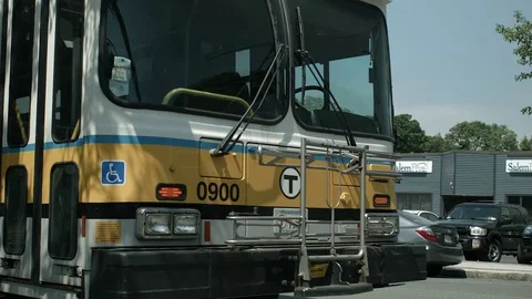 Parked Commuter T-Bus With Blinking Hazard Lights On A City Street 動画素材 76767891