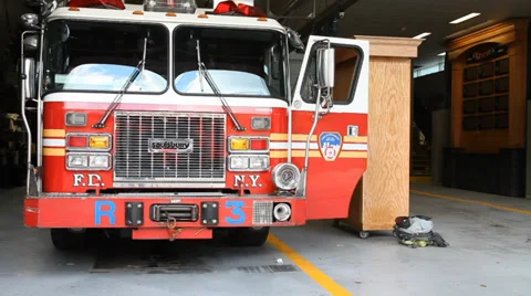 Parked firetruck in the firehall bay Stock Footage 33750138