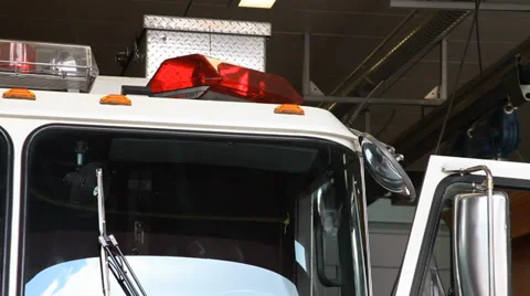Parked firetruck in the firehall bay Stock Footage 33750158