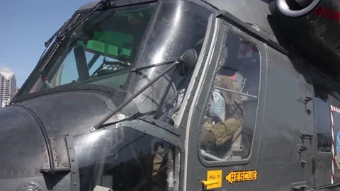 Parked helicopter spinning towards camera. Stock Footage 132185376
