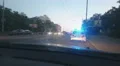 Parked police car with blue roof lights twirling, emergency, city road accident 4k or 4k+ Resolution
