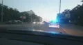 Parked police car with blue roof lights twirling, emergency, city road accident HD Footage
