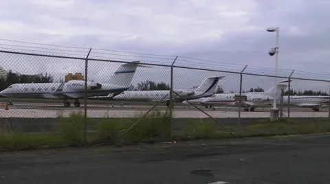 Parked Private Jet Planes 4 on Runway HD Stock Footage 1042200