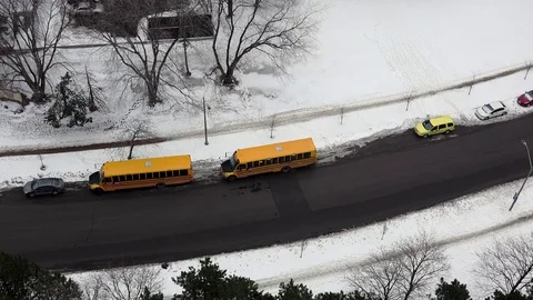 Parked School Buses and Snow Stock Footage 84511524