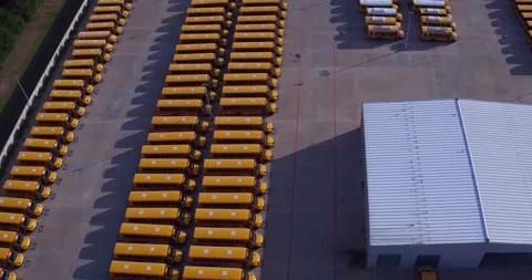 Parked School Buses Drone Pan 2 Stock Footage 138072308