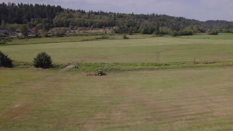 Parked Tractor in a field Stock Footage 251768735