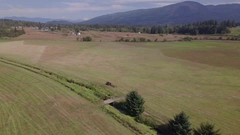 Parked Tractor in a field Stock Footage 251768815