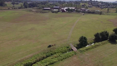 Parked Tractor in a field Stock Footage 251768958