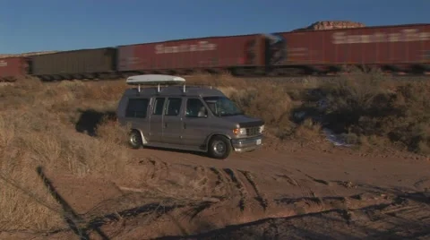 Parked van next to passing train Stock Footage 61575474