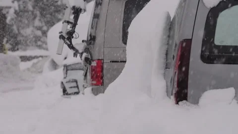 Parked vans covered in snow during heavy winter snowfall Stock-Footage 331868951