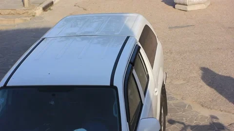 Parked white car Stock Footage 49958671