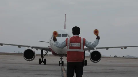 Parking Airplane. Aircraft Traffic Controller At The Airport Stock Footage 100058470