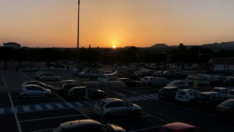 Parking area at sunset. Slow motion of cars at a shopping area Video stock 138214935