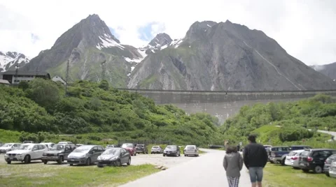 Parking auto on the background of snow-capped Alps Stock Footage 51916623