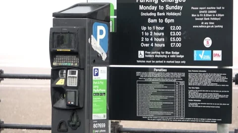 Parking charges board at the seafront Stock Footage 254306034