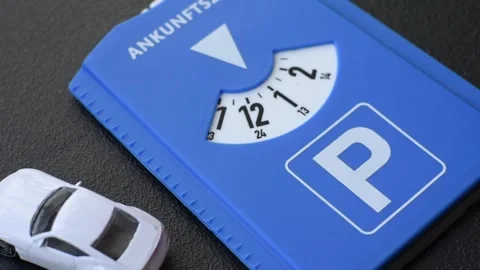 A parking disc, permit, or ticket for measuring time and paying municipal servic Stock Footage 319959629