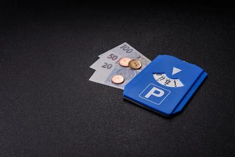 A parking disc, permit, or ticket for measuring time and paying municipal s.. Stock Photos