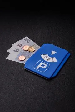 A parking disc, permit, or ticket for measuring time and paying municipal s.. Stock Photos