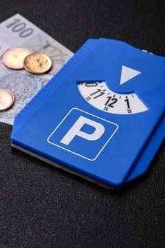 A parking disc, permit, or ticket for measuring time and paying municipal s.. Stock Photos
