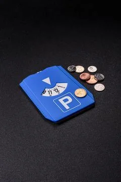A parking disc, permit, or ticket for measuring time and paying municipal s.. Stock Photos