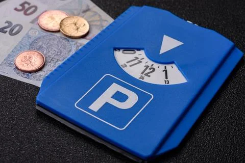 A parking disc, permit, or ticket for measuring time and paying municipal s.. Stock Photos
