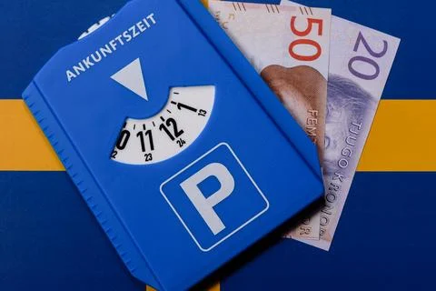 A parking disc, permit, or ticket for measuring time and paying municipal ser Stock Photos