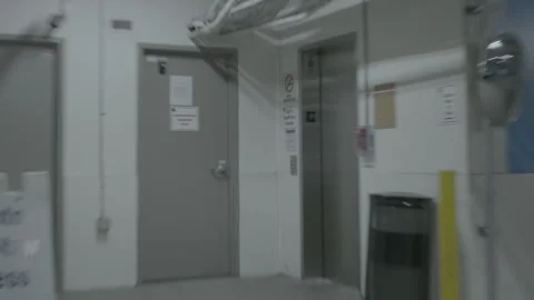 Parking Garage Elevator Lobby and Access Doors Stock Footage 343948347