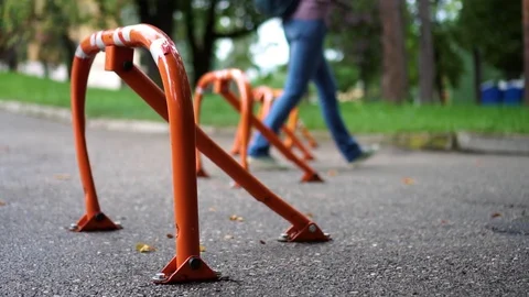Parking locks on the pavement in the park day Stock Footage 112004602