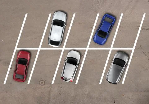 Parking lot with diagonal cars parked keeping distance Stock Photos