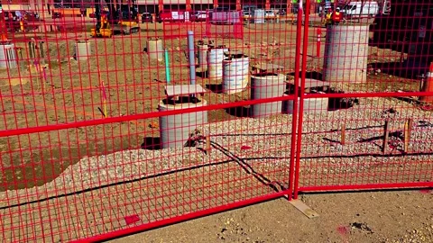 The parking lot at Unity Square is being excavated to construct a transit train 動画素材 309528910