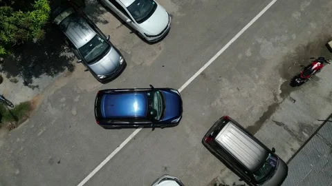 Parking Precision Top Aerial View of Blue Car in 4K 動画素材 261126584