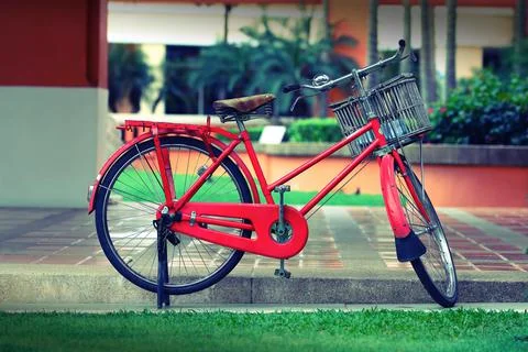 Parking red bicycle with basket for pattern Stock Photos